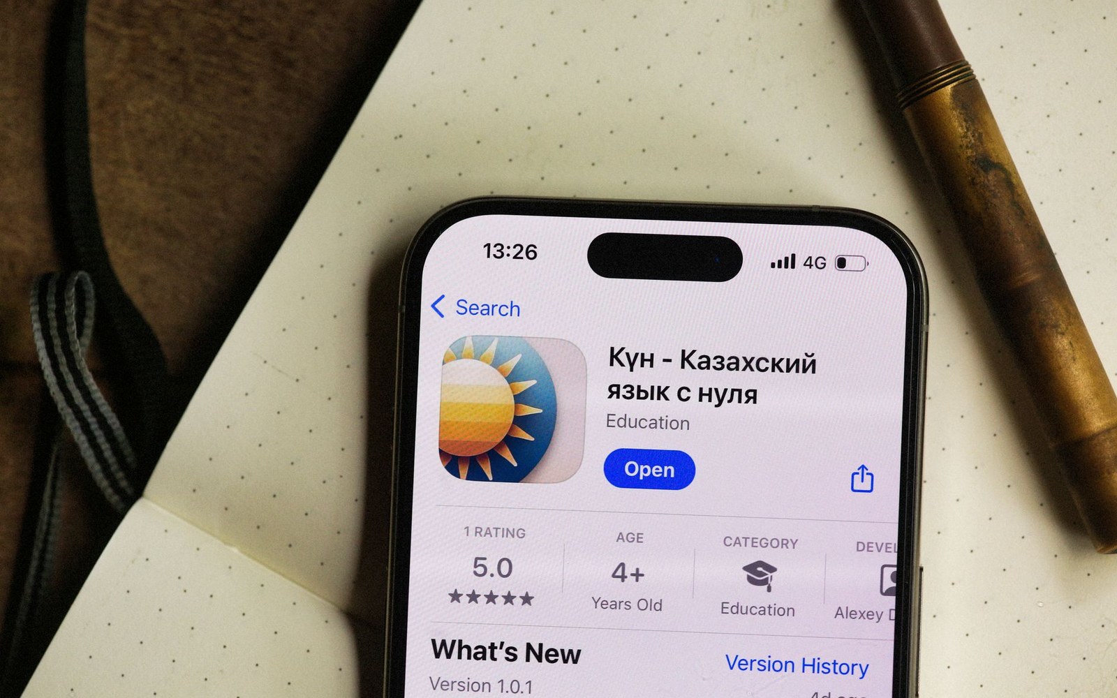 Smartphone screen showing an app store listing for a Kazakh language learning app