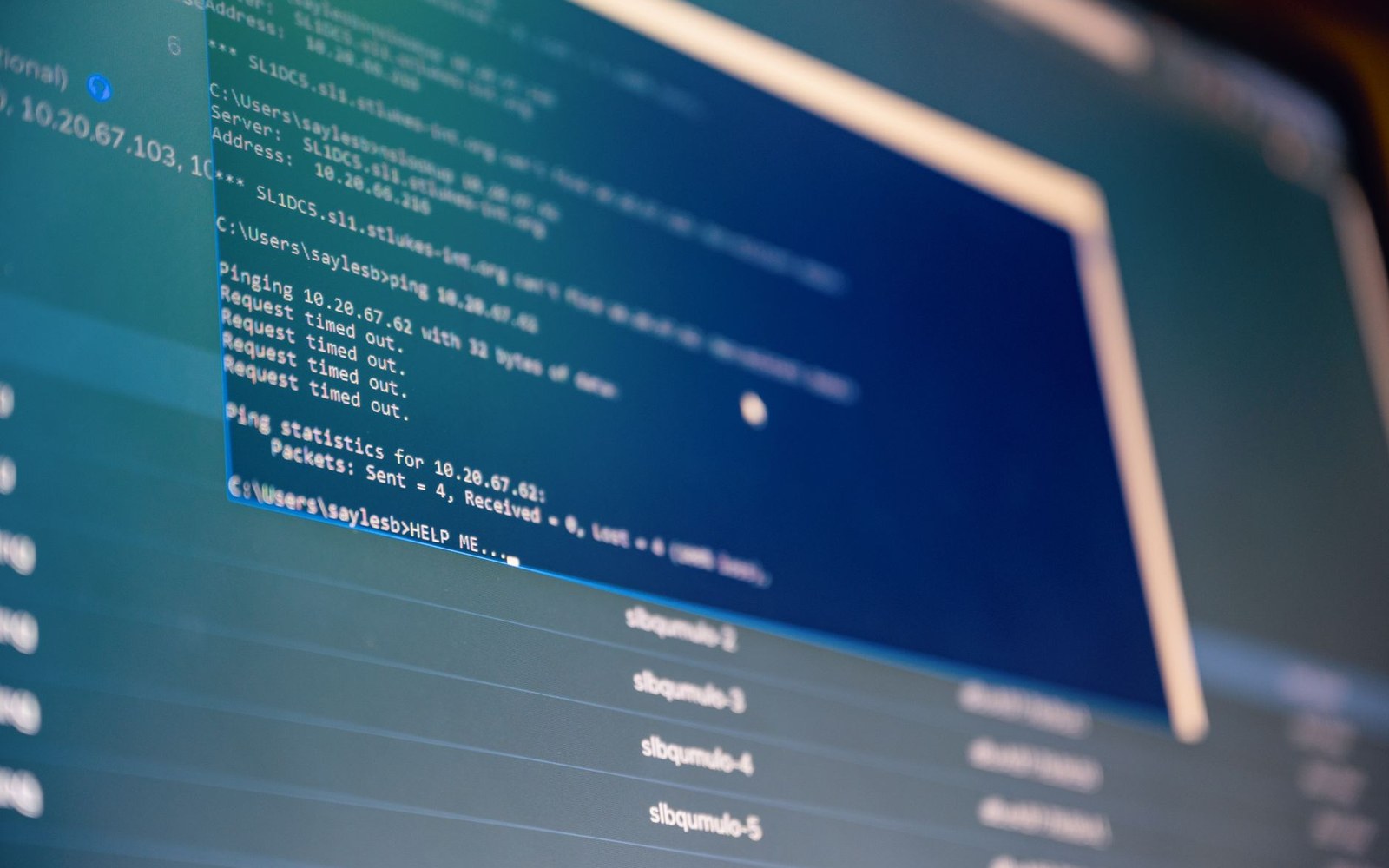 Computer screen showing a command prompt window with failed ping request timeouts